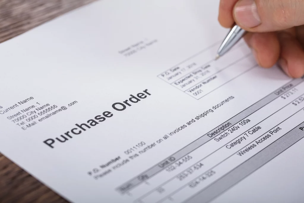A purchase order being reviewed, illustrating sourcing documentation